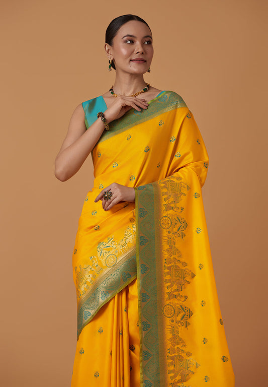 Monjolika Fashion Yellow Banarasi Silk Blend SareeWith Traditional & Modern Dulha Dulhan Figure Zari Woven Detailing | Swadesiicart