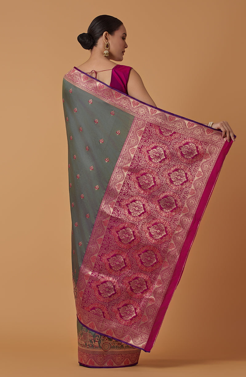 Monjolika Fashion Olive Banarasi Silk Blend SareeWith Traditional & Modern Dulha Dulhan Figure Zari Woven Detailing | Swadesiicart