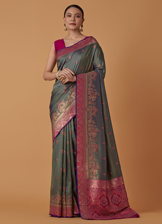 Monjolika Fashion Olive Banarasi Silk Blend SareeWith Traditional & Modern Dulha Dulhan Figure Zari Woven Detailing | Swadesiicart