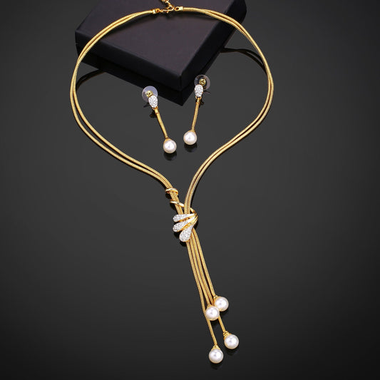 Estele Gold-Polished Trendy Tassel Necklace set with White Pearls for Women - Swadesiicart