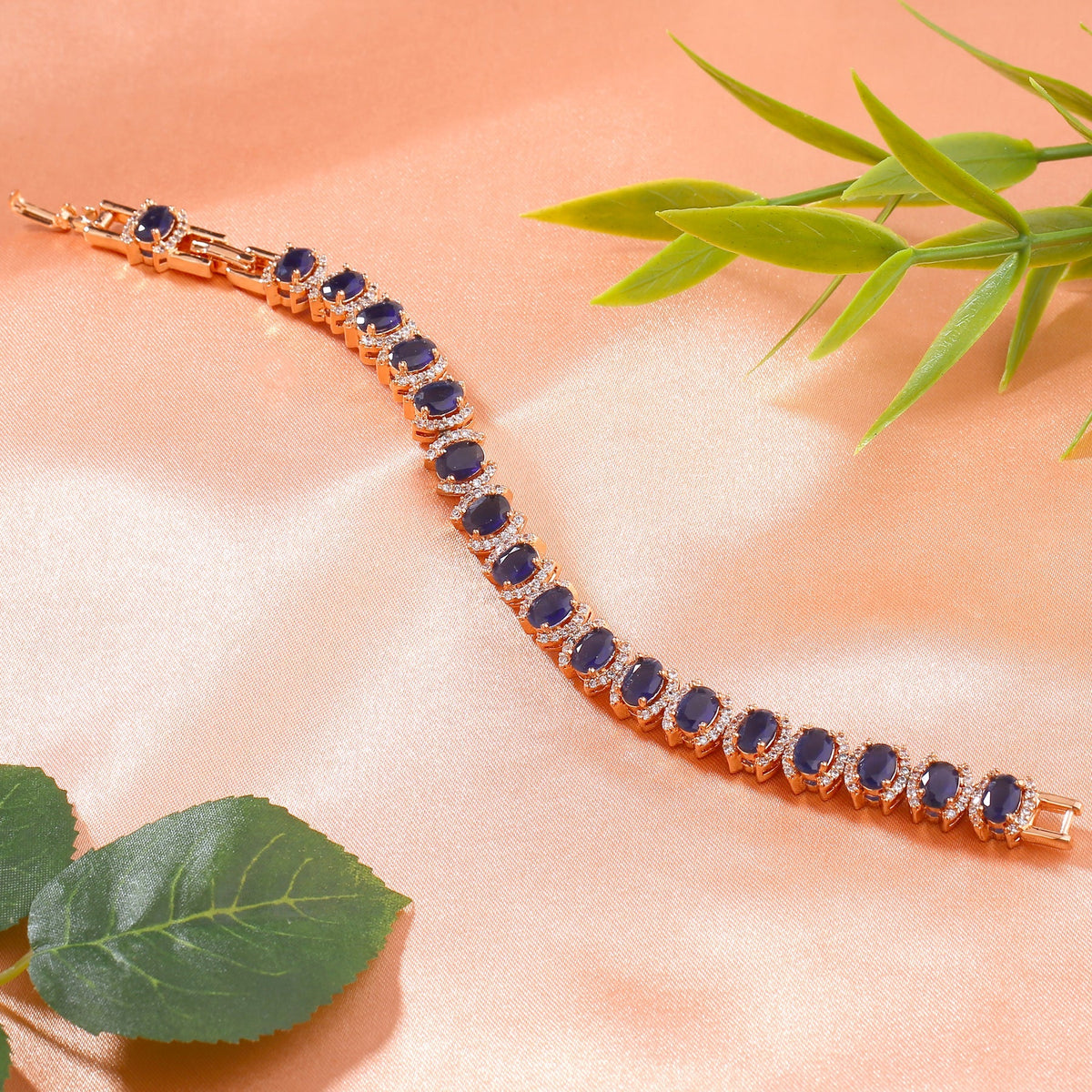 Estele Rose Gold-Polished CZ Ravishing Oval Designer Charm Bracelet with Blue American Diamonds for Women