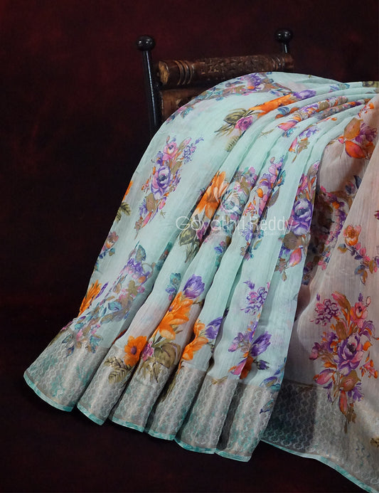 Shades of Sky Blue With Orange Blouse Floral Design Semi Chanderi Saree By Gayathri Reddy Designer Studio | Swadesiicart