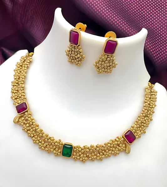 Jewel City Designer Gold Floral Necklace Set with Ruby Green Stones Elegant Matt Gold Finish Jewelry Set for Women | Swadesiicart