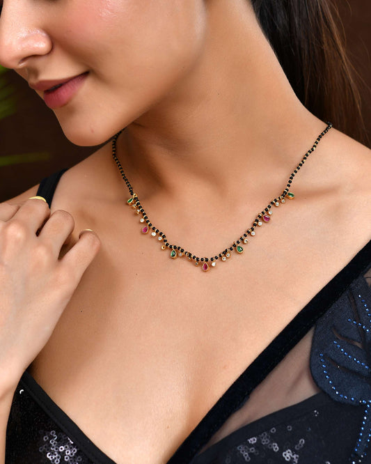 Jewels Nest Elegant Black Beads Mangalsutra with Green & Red Stone Drops – Silver Finish