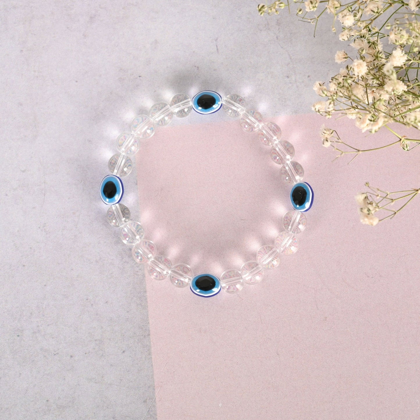 NVR Men & Women Evil Eyetransparent Beaded Elasticated Bracelet - Swadesiicart