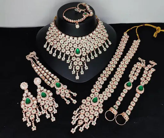 Jewel City Emerald Green Bridal Jewelry Set - Premium AD Choker Set with Nath, Earrings & Hand Chain - Handcrafted Wedding Collection Kundan Style | Swadesiicart