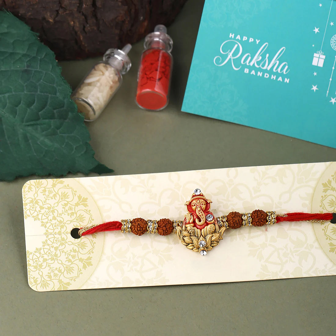 trueBrowns X Voylla Divine Rudraksha Ganesha Rakhi With Roli Chaawal Pack | Swadesiicart