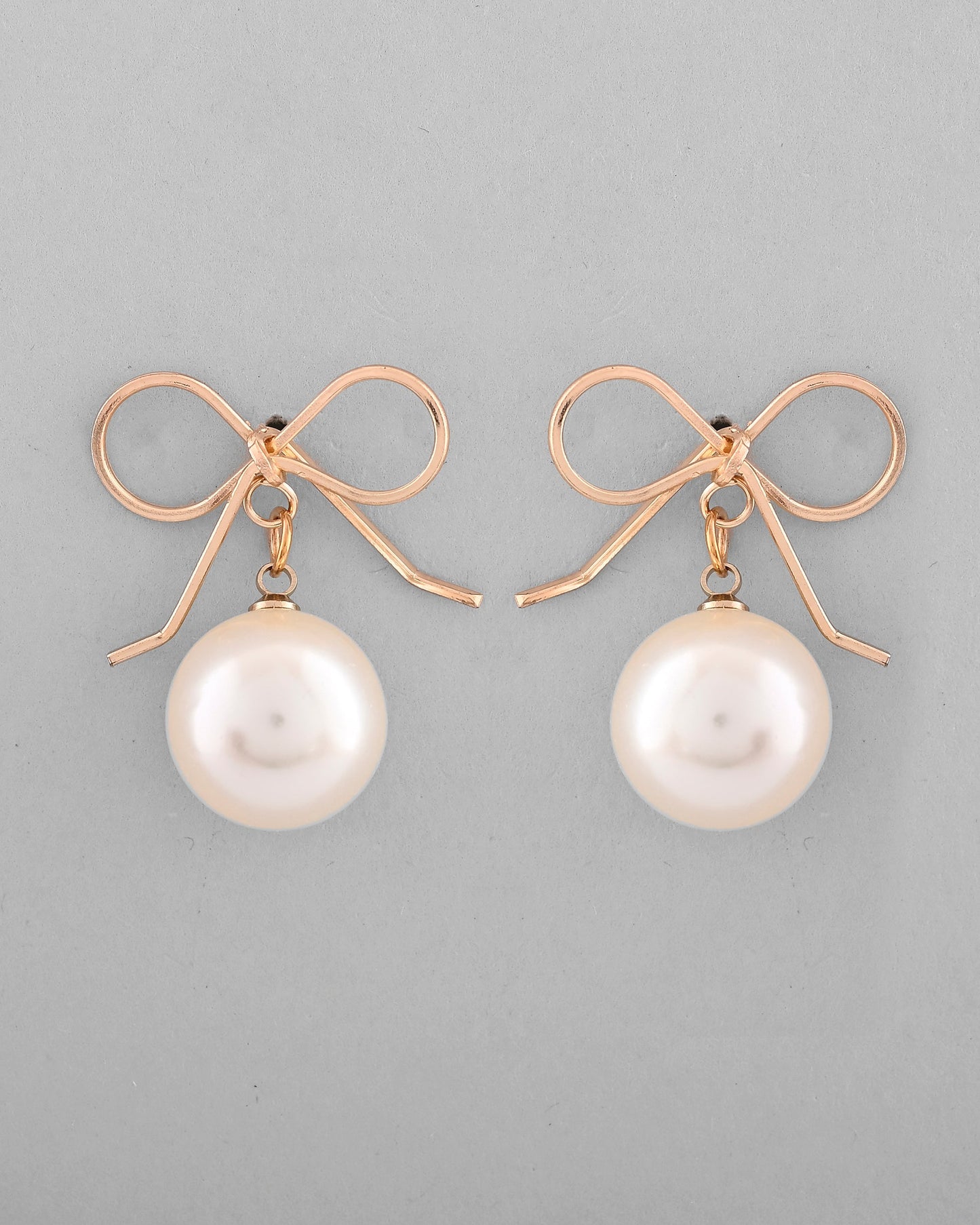 VOJ Gold-Polished Pearl & Bow Shaped Classic Drop Earrings - Swadesiicart