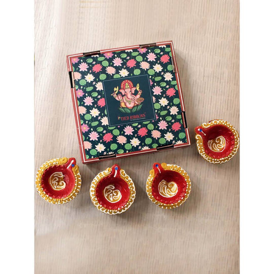 Tied Ribbons Set Of 4 Terracotta Diyas | Swadesiicart