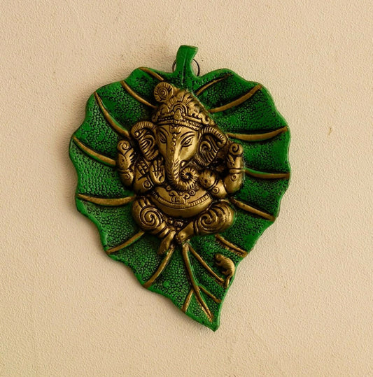 Swadesiicart Metal Golden Lord Ganesha On Green Leaf Wall Hanging Sculpture