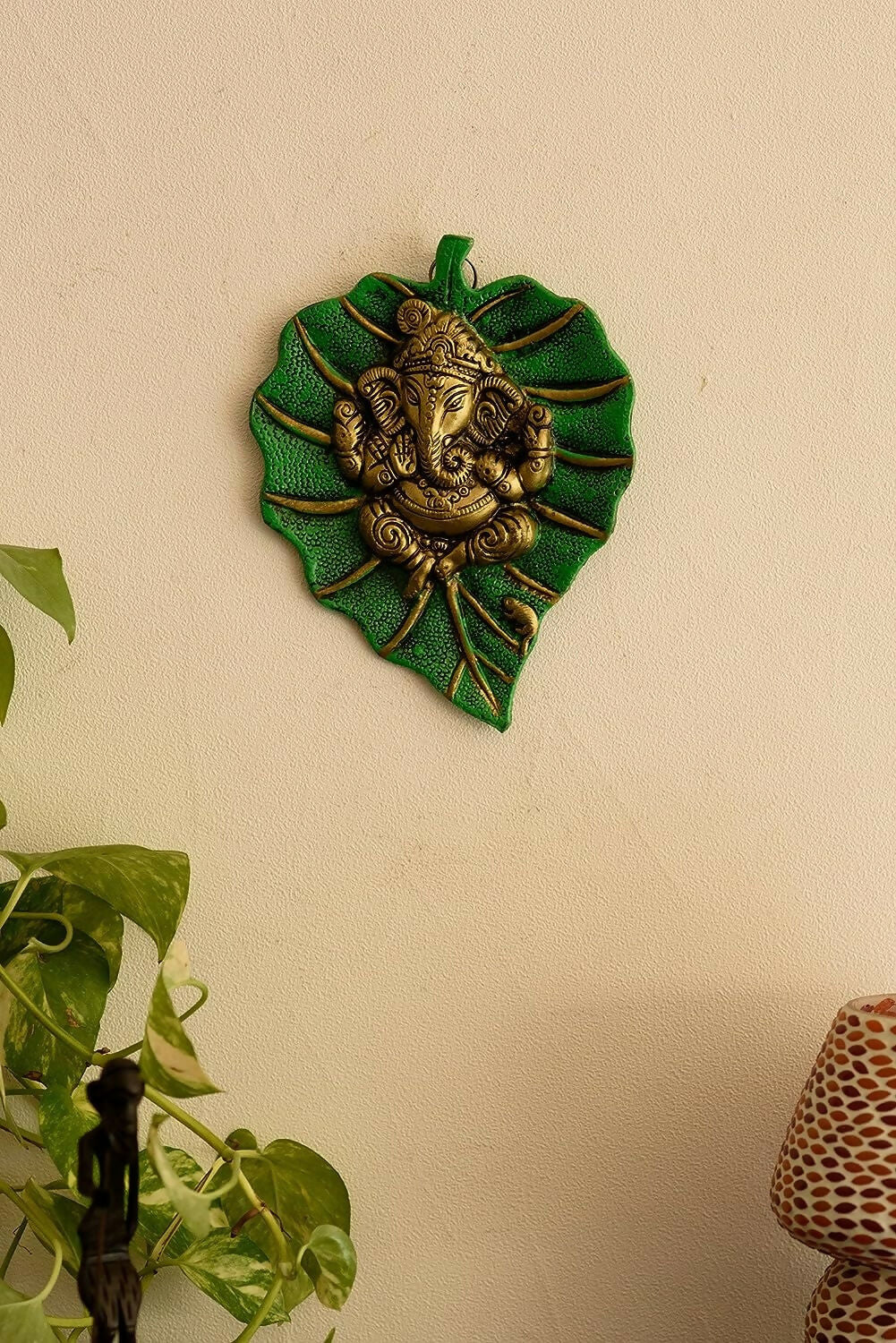 Swadesiicart Metal Golden Lord Ganesha On Green Leaf Wall Hanging Sculpture