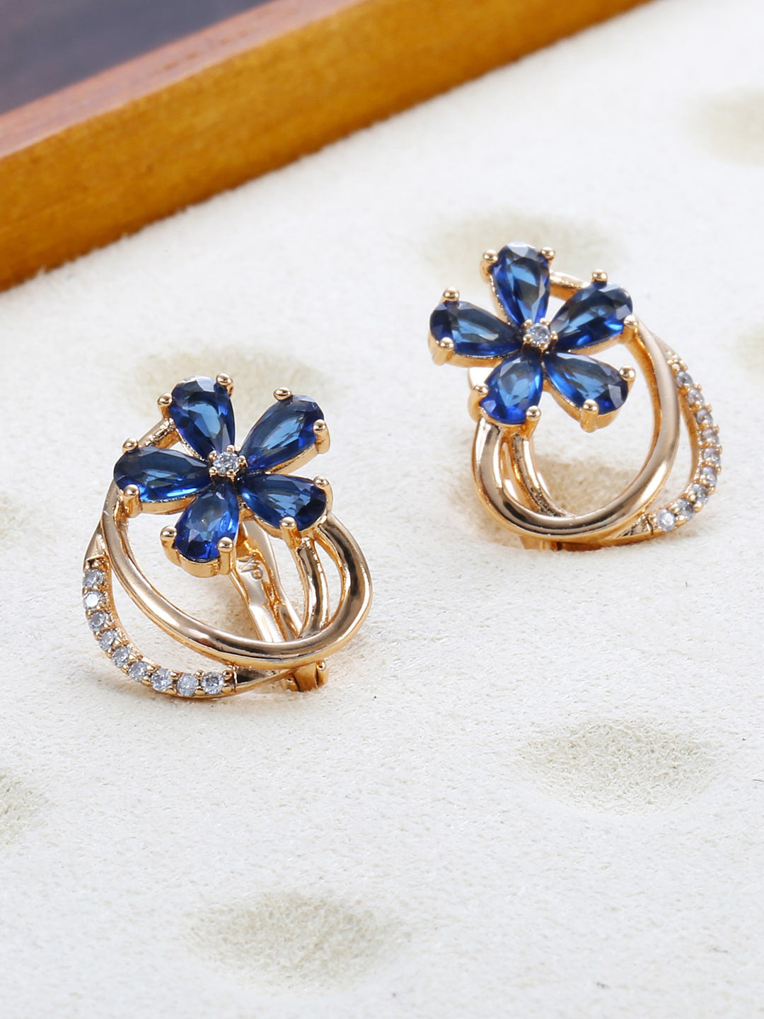 Shining Diva Rose Gold-Polished Blue Floral Studs Earrings - Swadesiicart