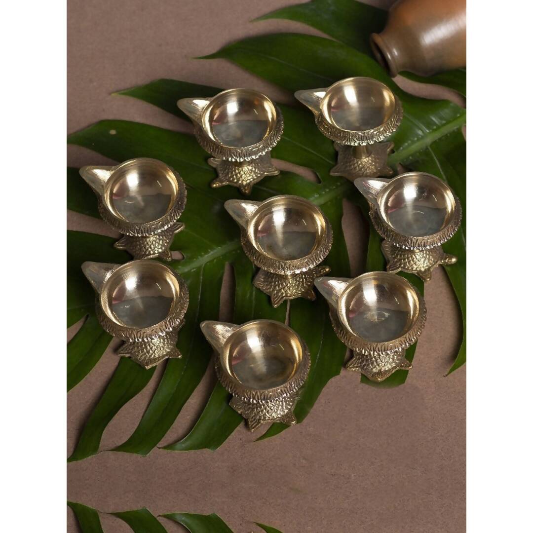 Tied Ribbons Gold Toned 8 Pieces Decorative Brass Diyas With Tortoise Base | Swadesiicart