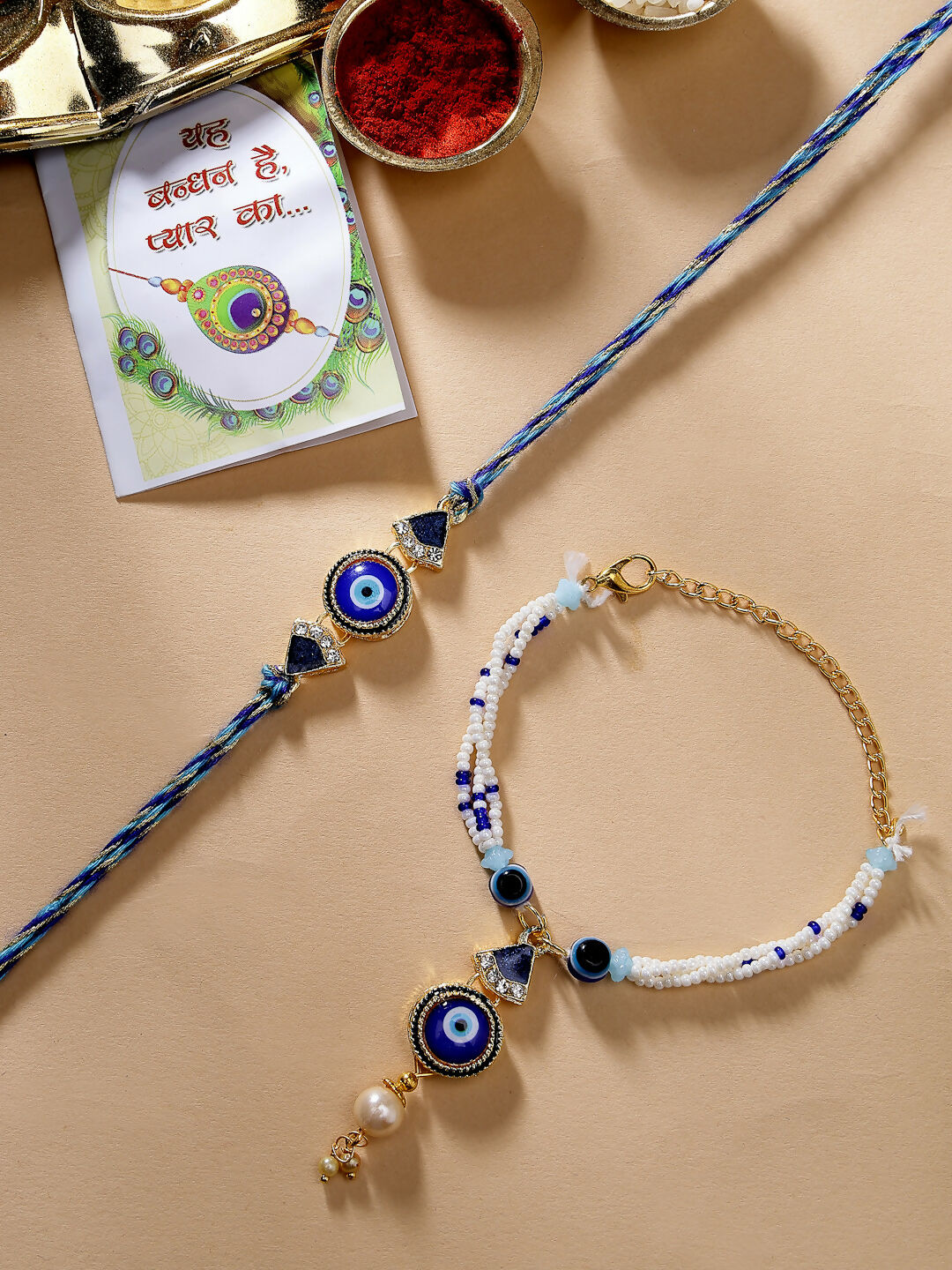 NVR Women & Men Set of 2 Blue Evil Eye Bhaiya Bhabhi Rakhi With Roli Chawal & Chocolate | Swadesiicart
