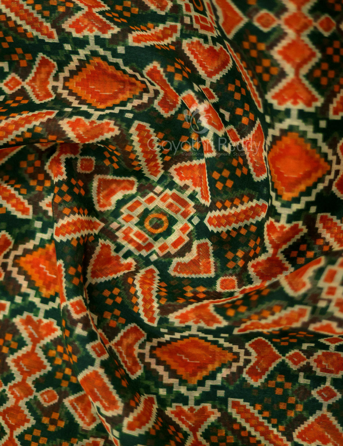 Shades of Dark Green And Orange Colour Patola Print Semi Chanderi Saree By Gayathri Reddy Designer Studio | Swadesiicart