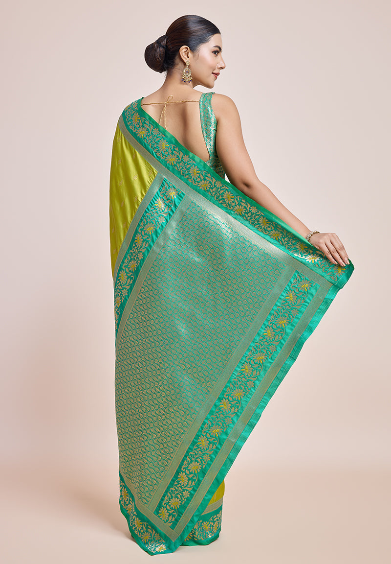 Monjolika Fashion Parrot Green Banarasi Silk In Satin Is Classy Embellished With Golden Zari Work Saree | Swadesiicart