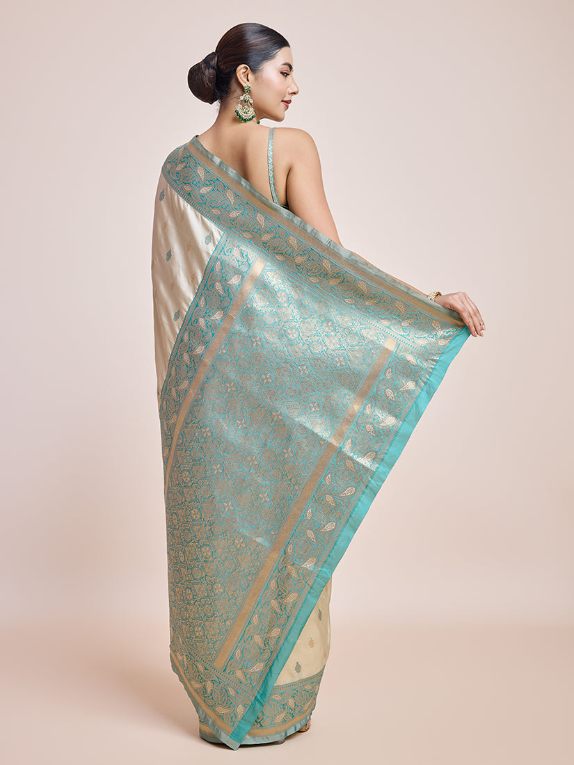 Monjolika Fashion Exquisite Designs With This Cream Banarasi Satin Silk Saree | Swadesiicart