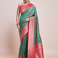 Monjolika Fashion Exquisite Designs With This Green Banarasi Satin Silk Saree | Swadesiicart