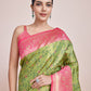 Monjolika Fashion Parrot Green Banarasi Tissue Silk SareeWith Zari Woven Work | Swadesiicart