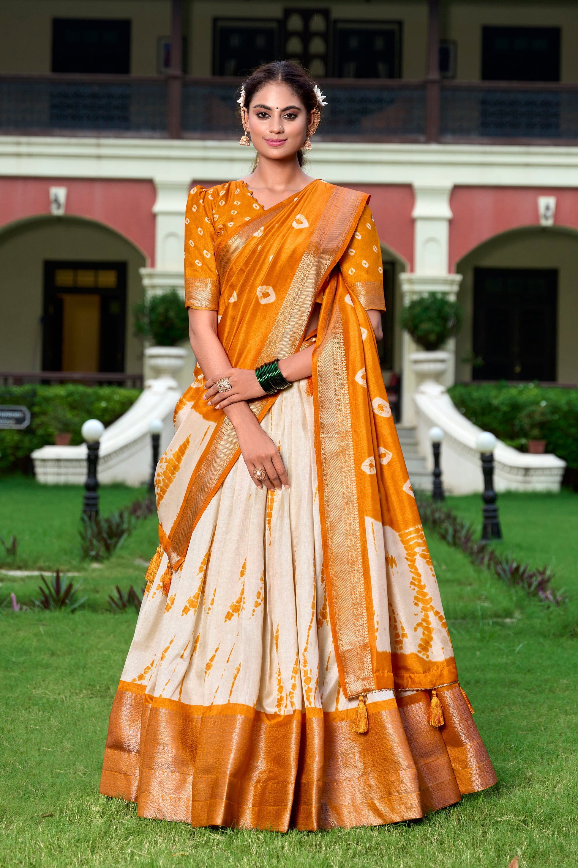 Lorenvalley Cream and Mustard Dola Silk Shibori Print With Zari Weaving Border Lehenga Choli | Swadesiicart