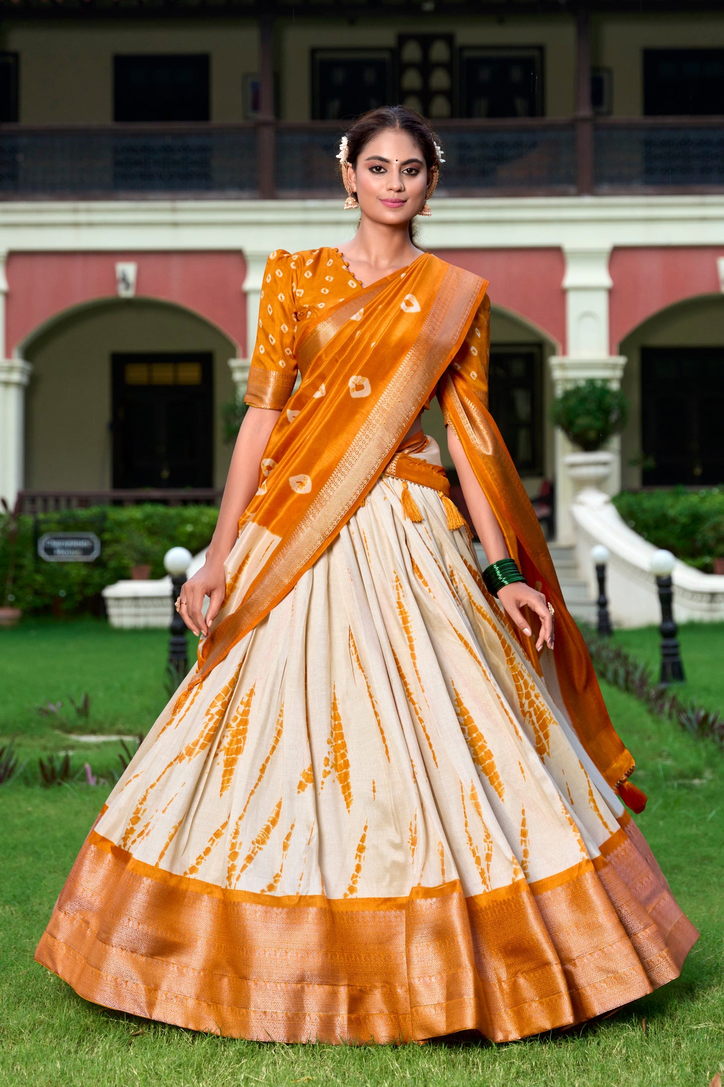 Lorenvalley Cream and Mustard Dola Silk Shibori Print With Zari Weaving Border Lehenga Choli | Swadesiicart