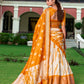 Lorenvalley Cream and Mustard Dola Silk Shibori Print With Zari Weaving Border Lehenga Choli | Swadesiicart