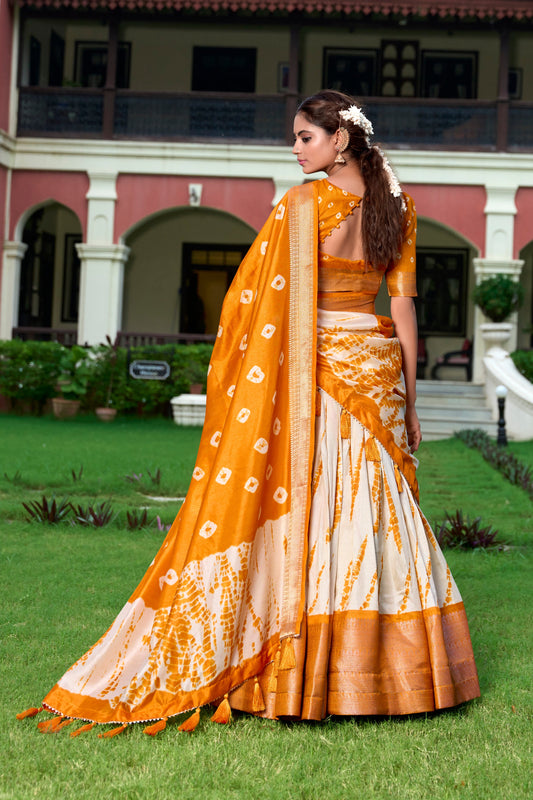 Lorenvalley Cream and Mustard Dola Silk Shibori Print With Zari Weaving Border Lehenga Choli | Swadesiicart