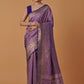 Monjolika Fashion Lavender Banarasi Silk Blend SareeWith Traditional & Modern Dulha Dulhan Figure Zari Woven Detailing | Swadesiicart