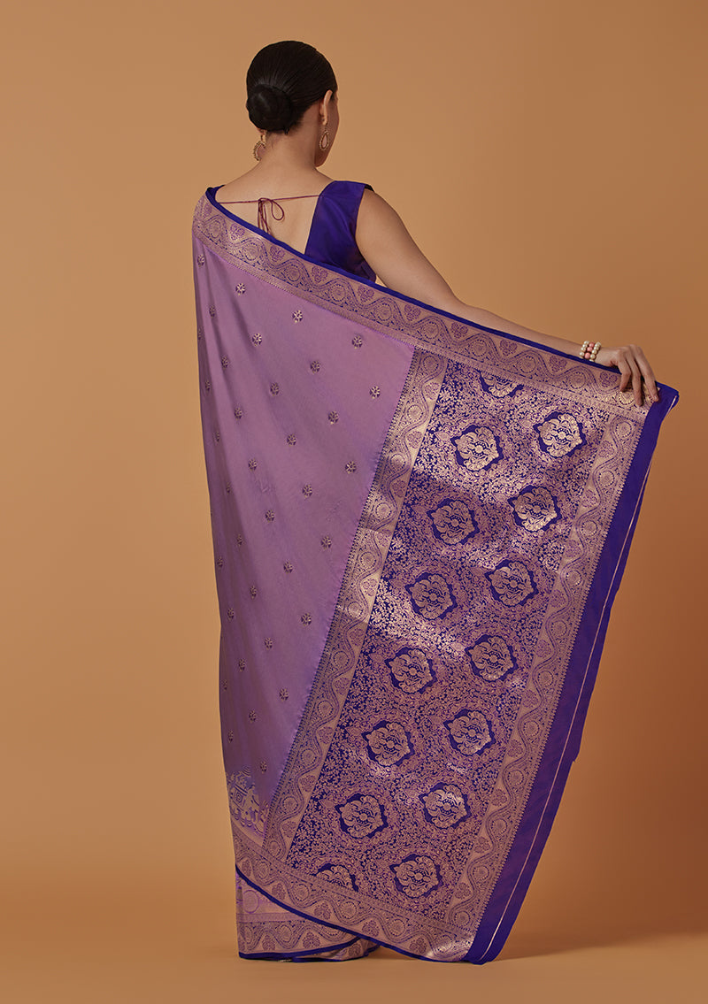 Monjolika Fashion Lavender Banarasi Silk Blend SareeWith Traditional & Modern Dulha Dulhan Figure Zari Woven Detailing | Swadesiicart