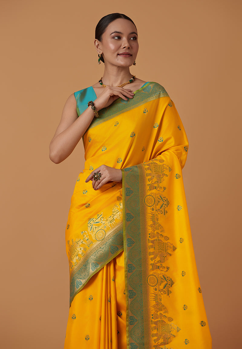 Monjolika Fashion Yellow Banarasi Silk Blend SareeWith Traditional & Modern Dulha Dulhan Figure Zari Woven Detailing | Swadesiicart