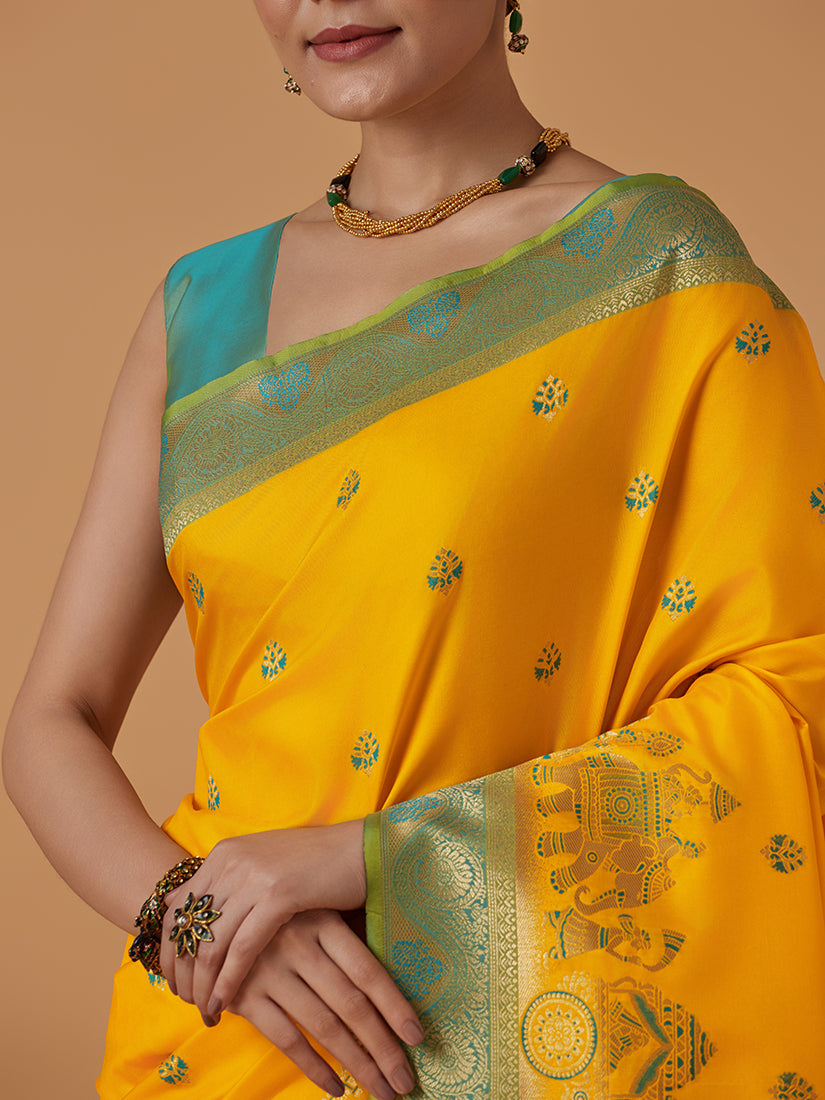 Monjolika Fashion Yellow Banarasi Silk Blend SareeWith Traditional & Modern Dulha Dulhan Figure Zari Woven Detailing | Swadesiicart