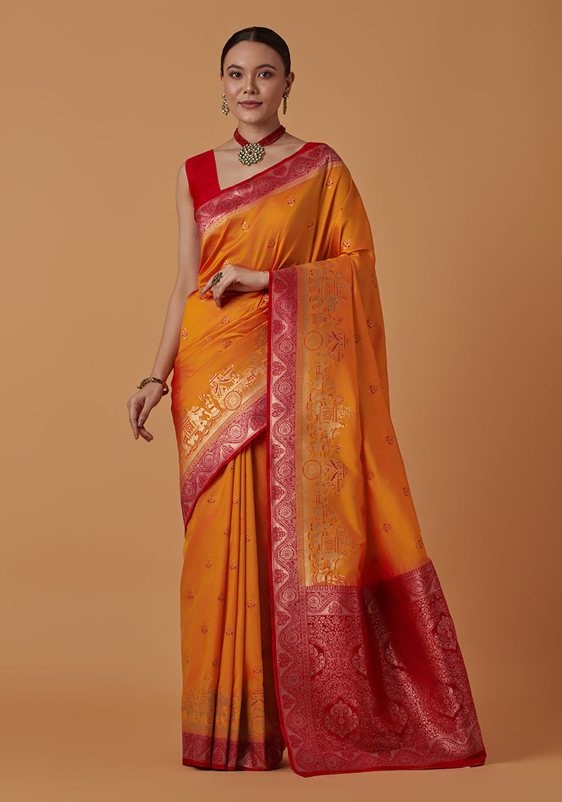 Monjolika Fashion Amber Banarasi Silk Blend SareeWith Traditional & Modern Dulha Dulhan Figure Zari Woven Detailing | Swadesiicart
