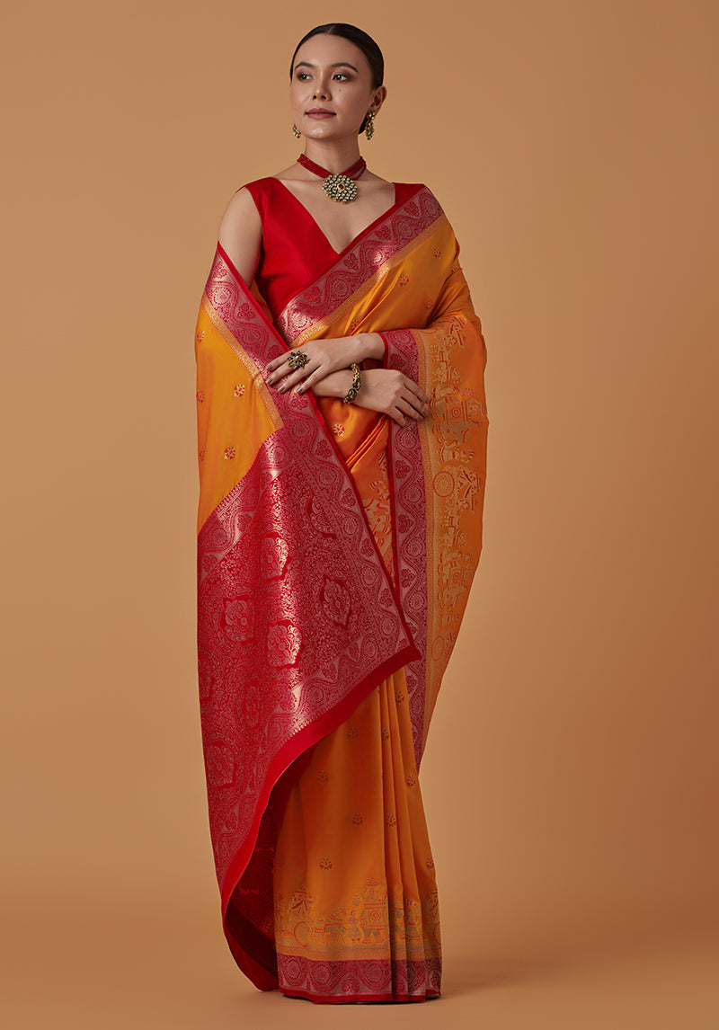 Monjolika Fashion Amber Banarasi Silk Blend SareeWith Traditional & Modern Dulha Dulhan Figure Zari Woven Detailing | Swadesiicart