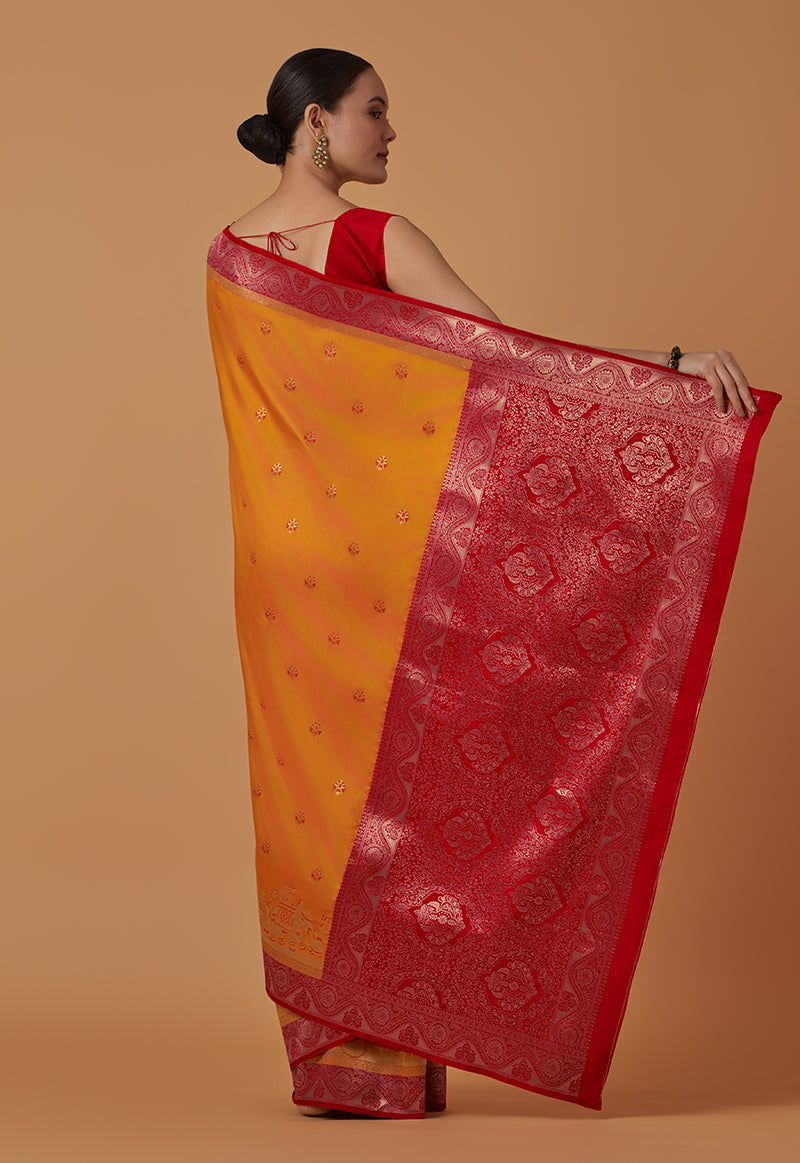 Monjolika Fashion Amber Banarasi Silk Blend SareeWith Traditional & Modern Dulha Dulhan Figure Zari Woven Detailing | Swadesiicart