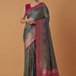 Monjolika Fashion Olive Banarasi Silk Blend SareeWith Traditional & Modern Dulha Dulhan Figure Zari Woven Detailing | Swadesiicart