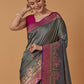 Monjolika Fashion Olive Banarasi Silk Blend SareeWith Traditional & Modern Dulha Dulhan Figure Zari Woven Detailing | Swadesiicart