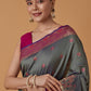 Monjolika Fashion Olive Banarasi Silk Blend SareeWith Traditional & Modern Dulha Dulhan Figure Zari Woven Detailing | Swadesiicart