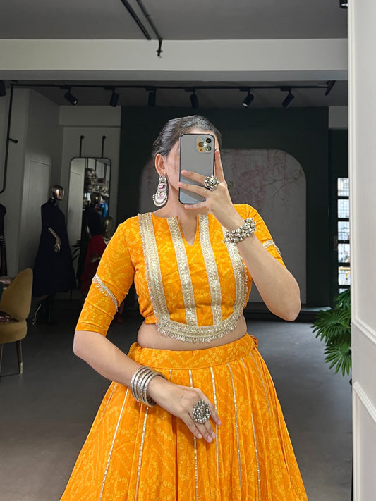 Lorenvalley Fashion Yellow Chiffon Bandhej Print with Sequins and Gotta Patti Lace Touch Up Lehenga Choli | Swadesiicart