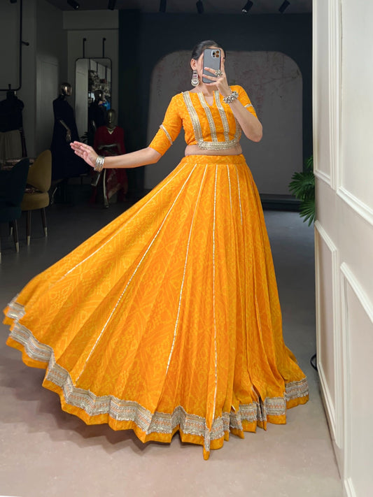 Lorenvalley Fashion Yellow Chiffon Bandhej Print with Sequins and Gotta Patti Lace Touch Up Lehenga Choli | Swadesiicart
