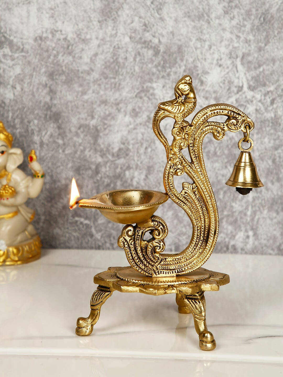 CraftVatika Gold-Toned Brass Handmade Decorative Peacock Design Diya with Bell & Stand | Swadesiicart