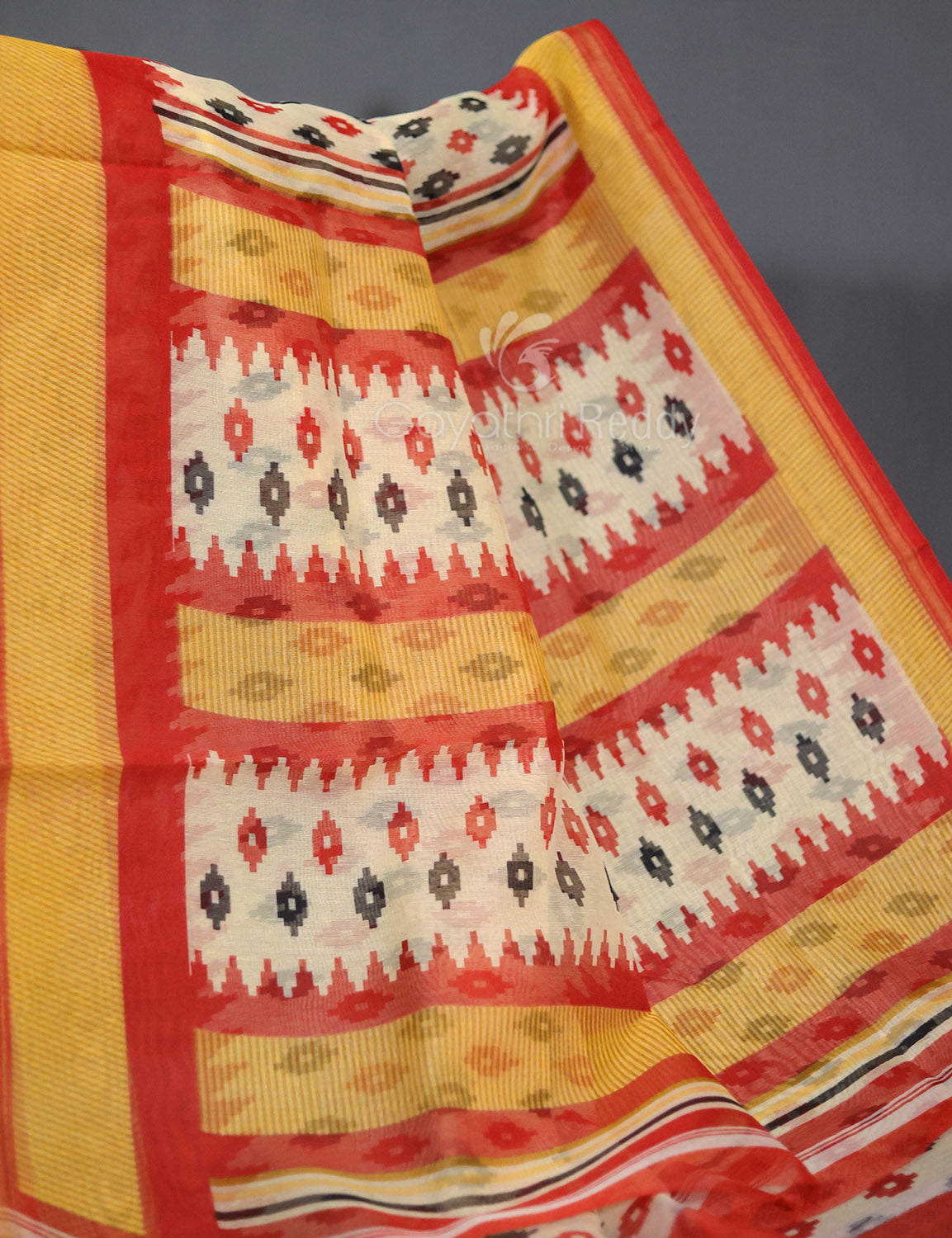 Shades of Cream And Red Colour Blouse Patola Print Semi Chanderi Saree By Gayathri Reddy Designer Studio | Swadesiicart