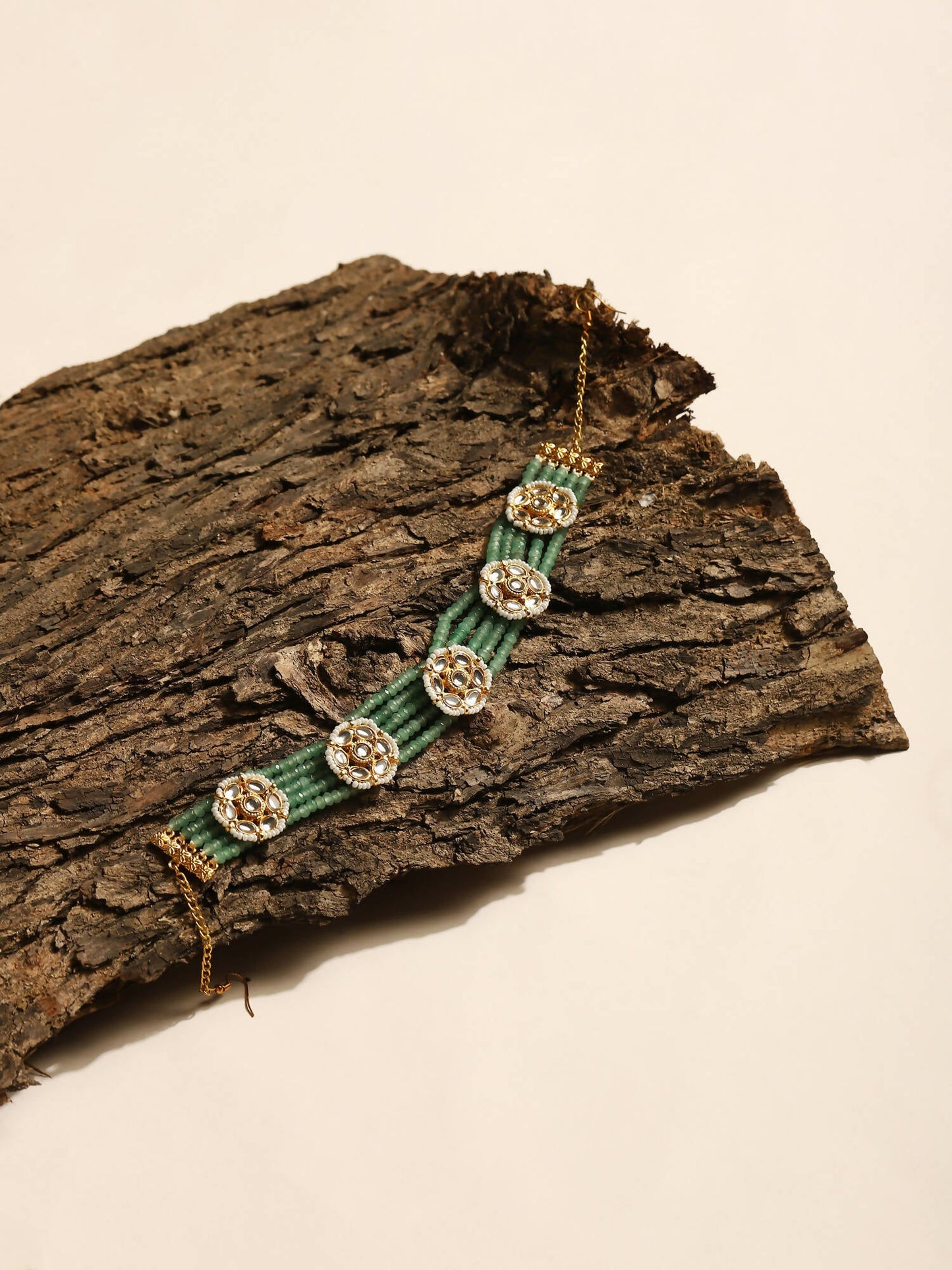 Gold-Polished Green Kundan Studded Headband - Ruby Raang | Swadesiicart