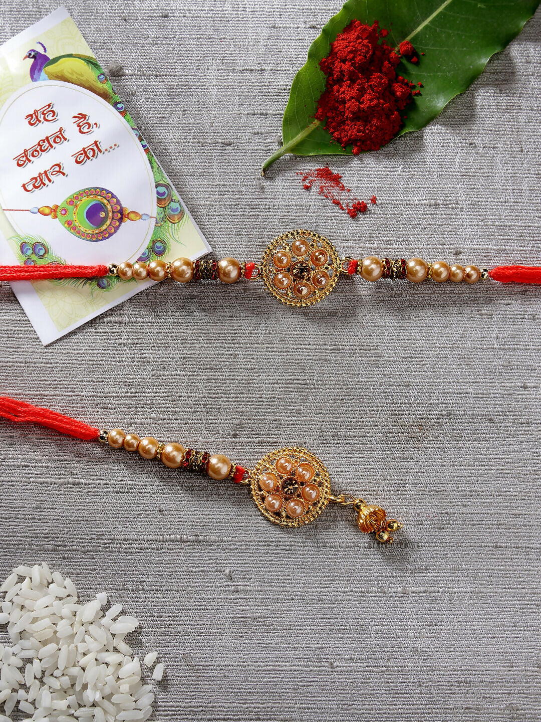 NVR Women & Men Set of 2 Gold-Toned Stone-Studded & Beaded Bhaiya Bhabi Rakhi With Roli Chawal | Swadesiicart