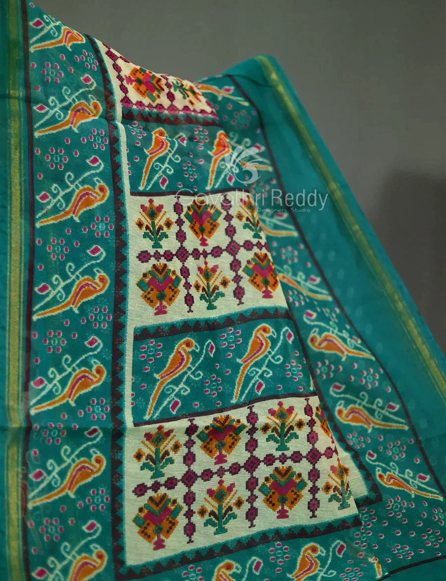 Vibrant Shades of Cream Patola Print Semi Chanderi Saree By Gayathri Reddy Designer Studio | Swadesiicart