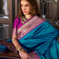 Anaita Teal Soft Banarasi Silk Zari Weaving Saree With Blouse Piece