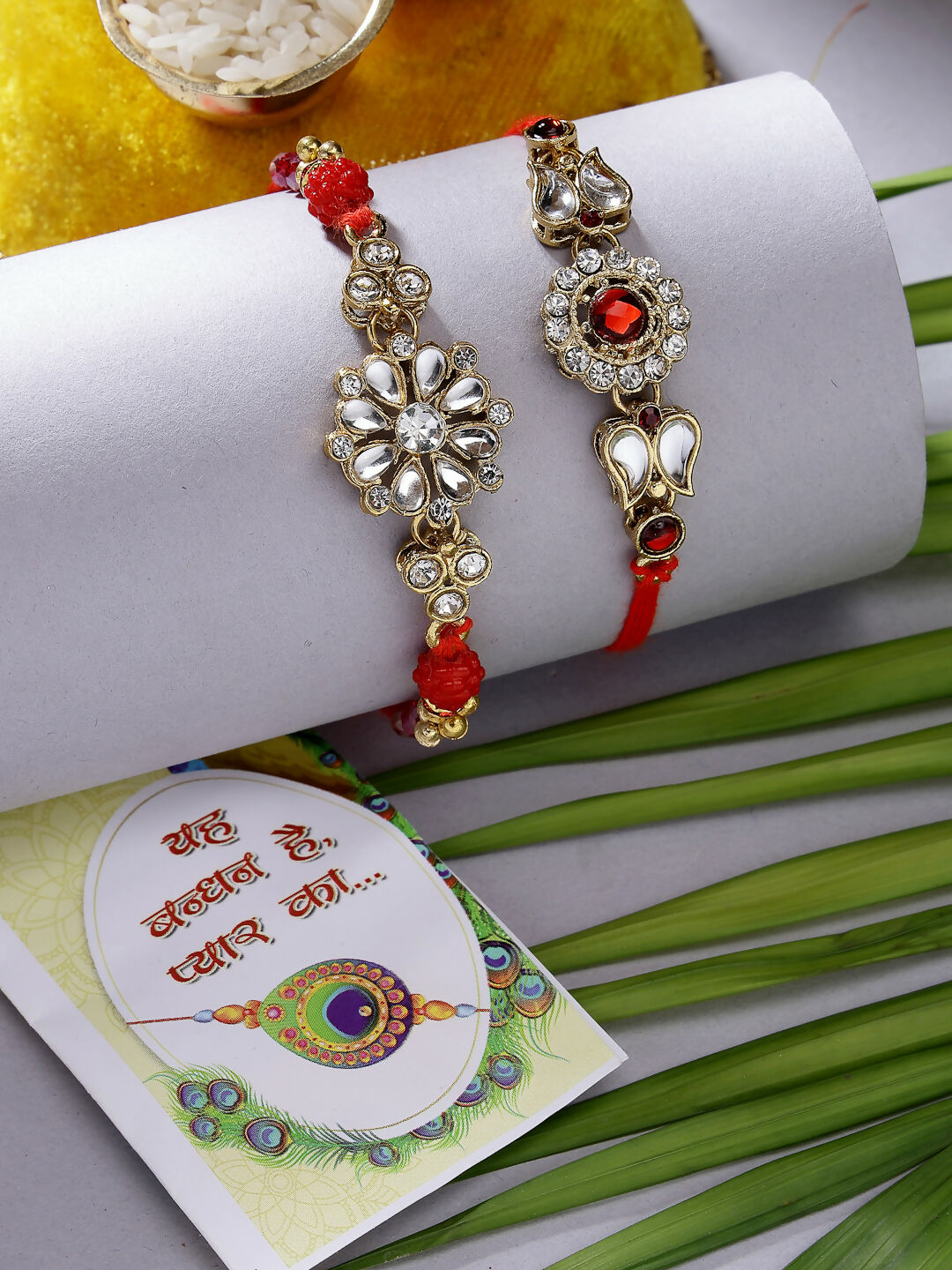 NVR Men Set of 2 Gold-Toned Stone-Studded Rakhi With Roli Chawal & Chocolate | Swadesiicart