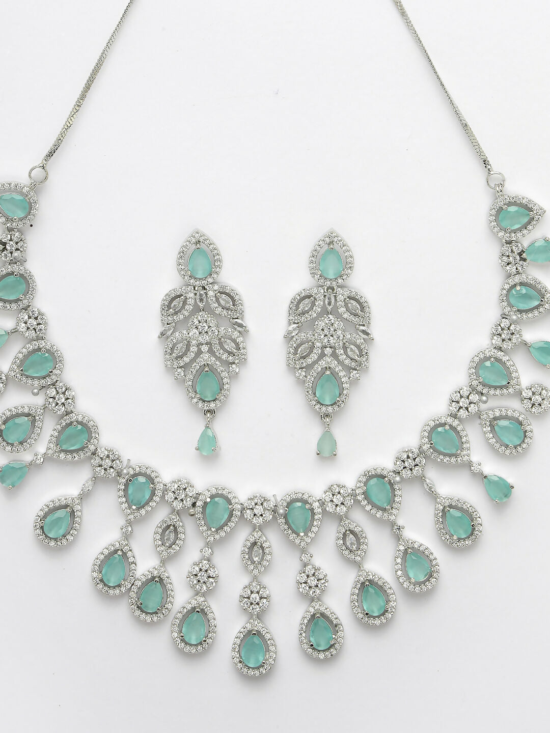 NVR Women's silver plated Turquoise CZ stone handcrafted jewellery set - Swadesiicart