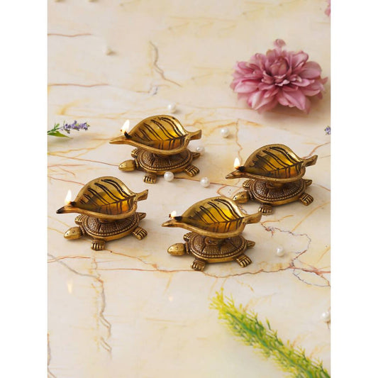 eCraftIndia 4 Pieces Beige Tortoise Statue Leaf Design Diyas | Swadesiicart
