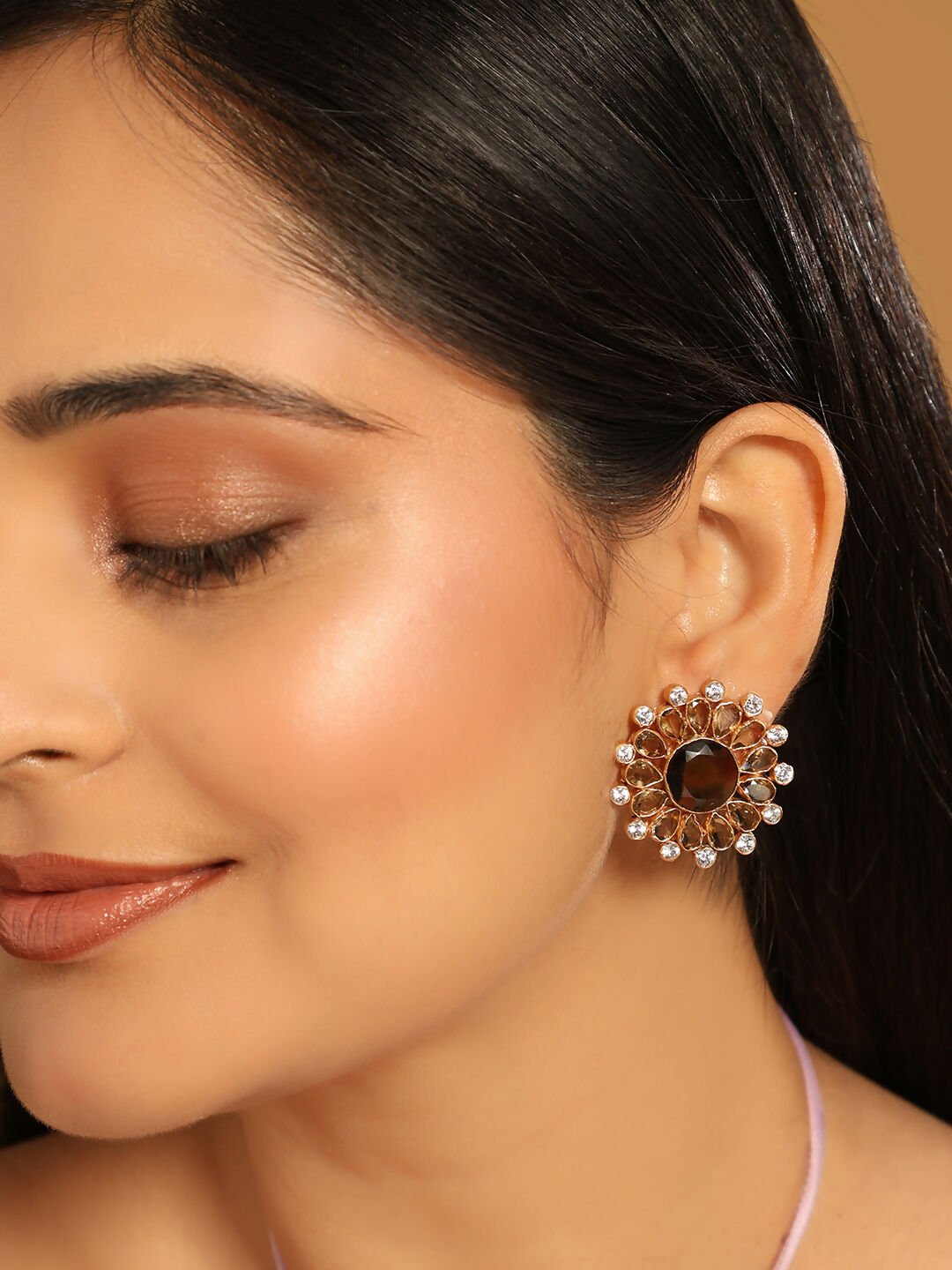 Nuyug 22K Gold Plated Faux Smoky Quartz & White Crystal Studded Contemporary Floral Shaped Studs | Swadesiicart