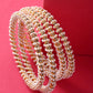Gold-Polished Alloy Pearl And Rhinestones Studded Bangle Set - The Pari - The Pari - Dinesh Associates